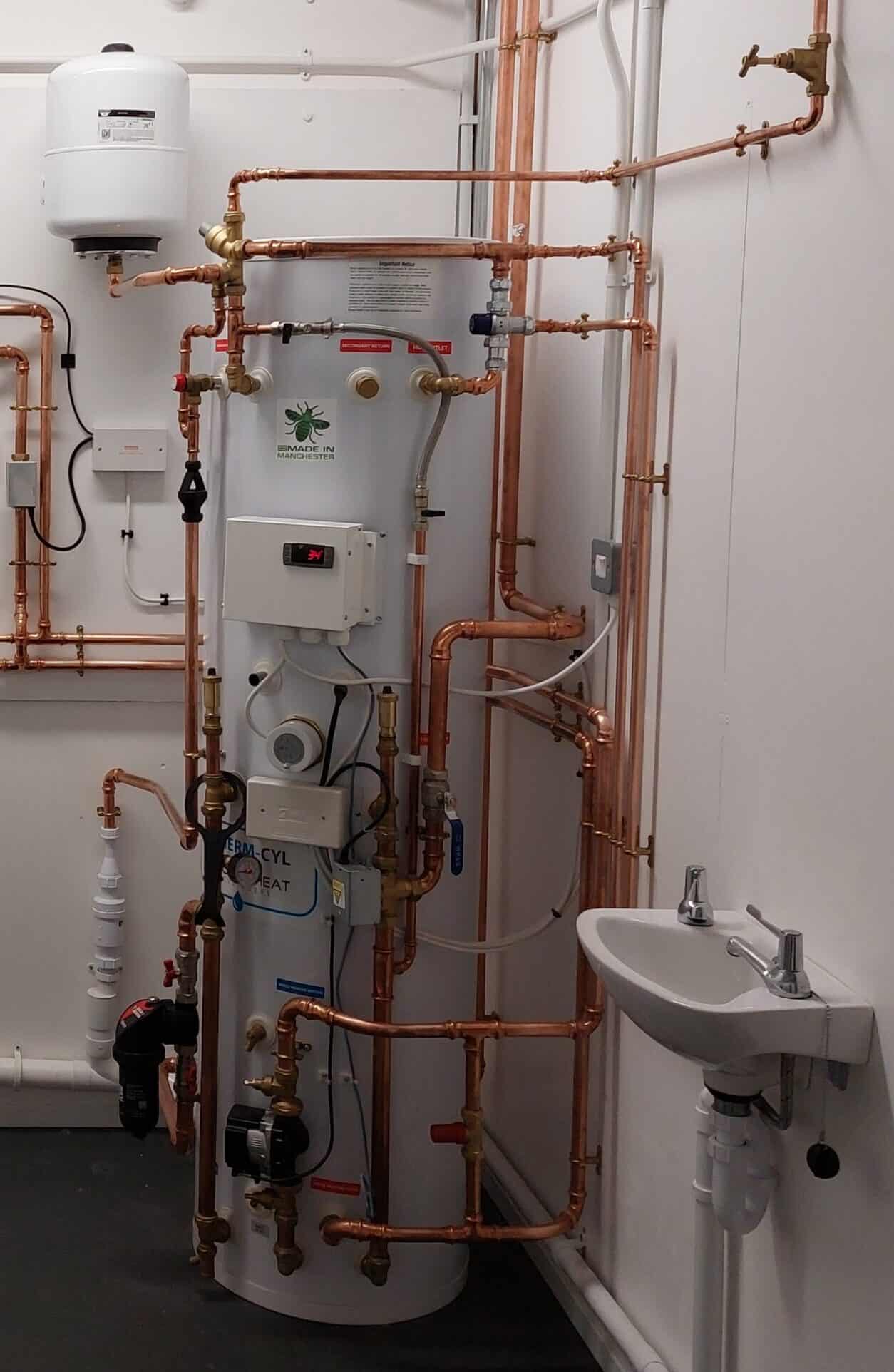 Low Temperature Heating and Hot Water Systems in Dwellings